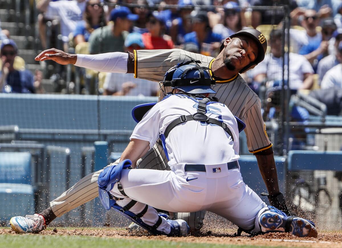 San Diego Padres right fielder José  Azocar is tagged out by Dodgers catcher Austin Barnes.