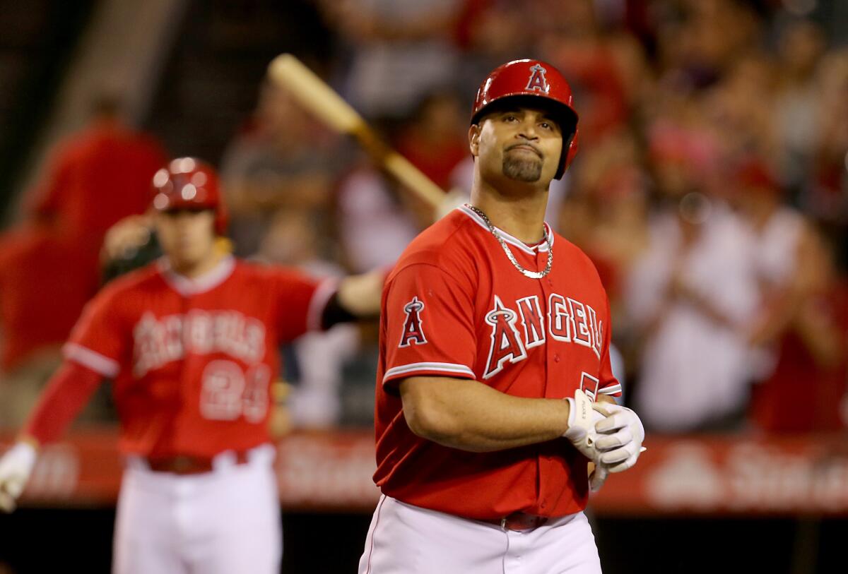 Albert Pujols reacts after flying out and stranding the tying run in the ninth inning against the Athletics on Sept. 30.