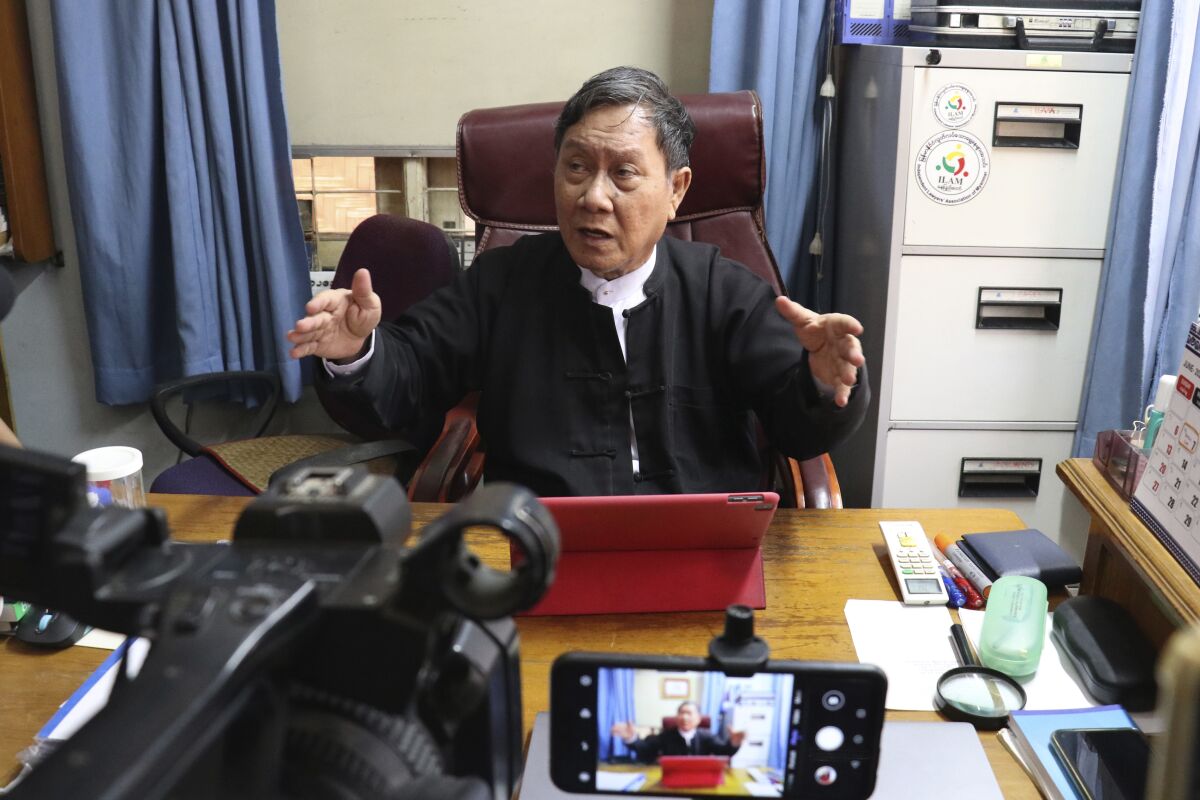 FILE - In this May 24, 2021, file photo, Khin Maung Zaw, a lawyer assigned by the National League for Democracy party to represent deposed Myanmar leader Aung San Suu Kyi, speaks to journalists in Naypyitaw, Myanmar. Khin Maung Zaw, who is being tried on multiple criminal charges, said late Thursday, Oct. 14, 2021 he has been issued a gag order barring him from talking about her cases. (AP Photo)