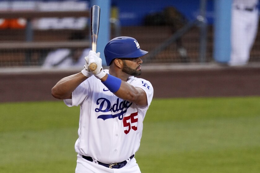 Los Angeles Dodgers' Albert Pujols bats during the first inning of a baseball game against the Arizona Diamondbacks Monday, May 17, 2021, in Los Angeles. (AP Photo/Mark J. Terrill)