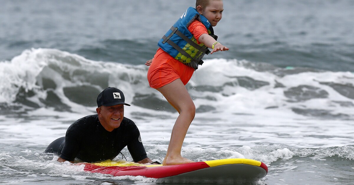 Miracles for Kids brings critically ill children, families to Newport Pier for day in the surf