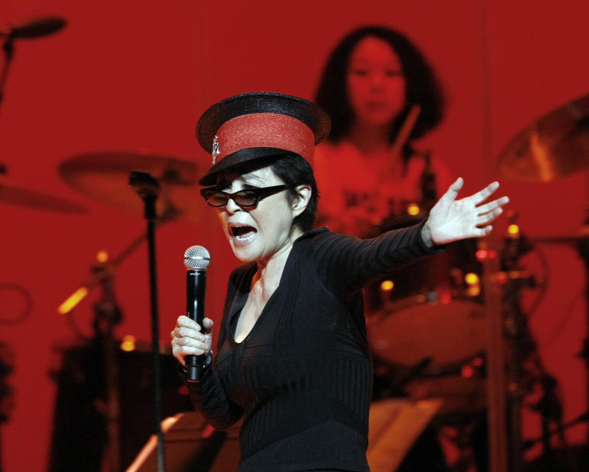 Yoko Ono performing in 2010 with the Plastic Ono Band at the Orpheum Theatre in Los Angeles.