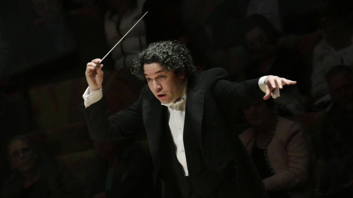 "I want people to close their eyes and listen and say, 'This is the sound of the L.A. Philharmonic,'" Gustavo Dudamel said. He's pictured here conducting the Los Angeles Philharmonic in John Adams' "City Noir" at Walt Disney Concert Hall.