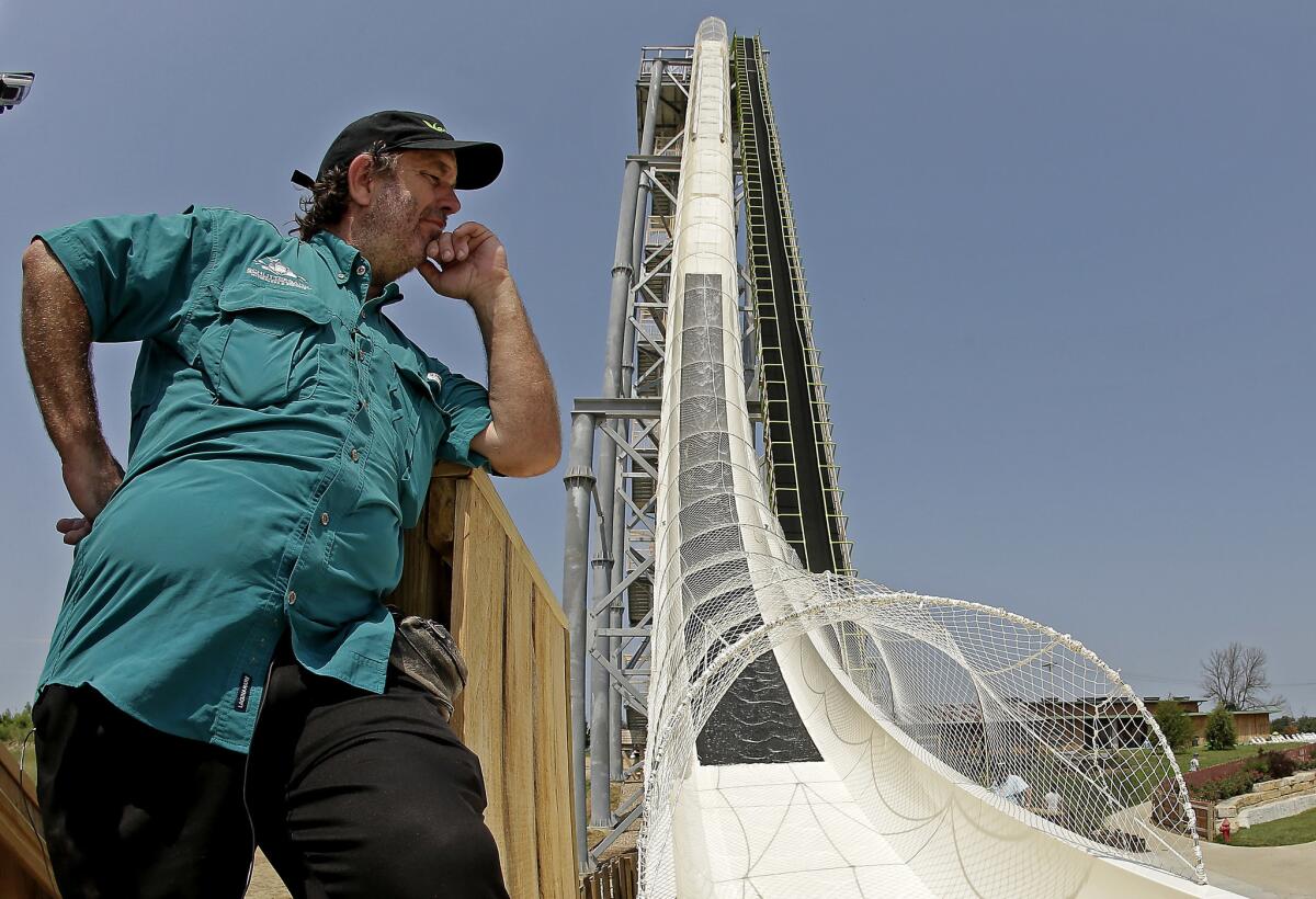 Jeffrey Henry looks over Verruckt, the world's tallest waterslide at the time, at Schlitterbahn Waterpark in Kansas City, Kan., in 2014.