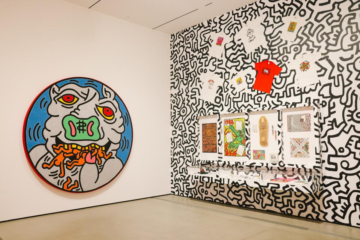 Greed is the subject of "Untitled," 1988, left, paired with various items offered at Keith Haring's store, the Pop Shop