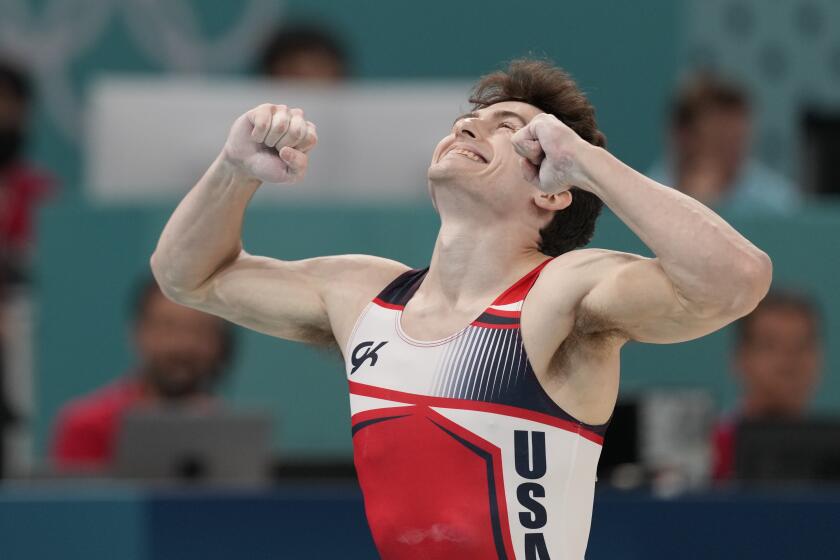 Stephen Nedoroscik, of the United States, celebrates during the men's artistic gymnastics.