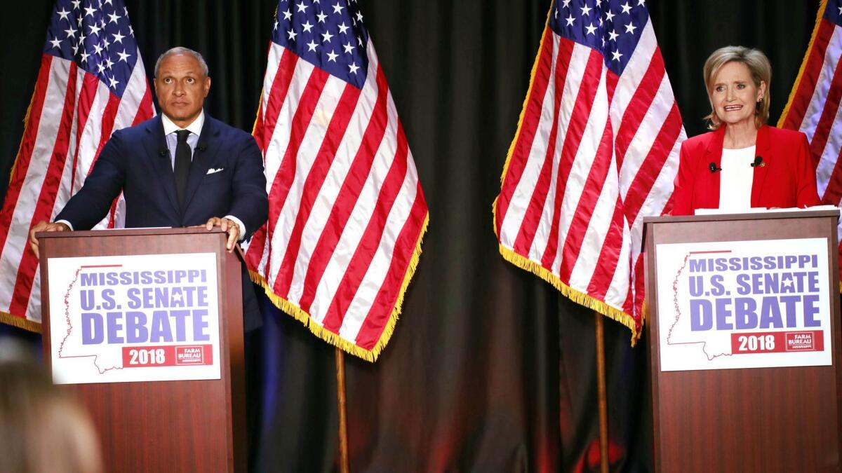 Democrat Mike Espy and Sen. Cindy Hyde-Smith (R-Miss.) during their debate on Nov. 20.