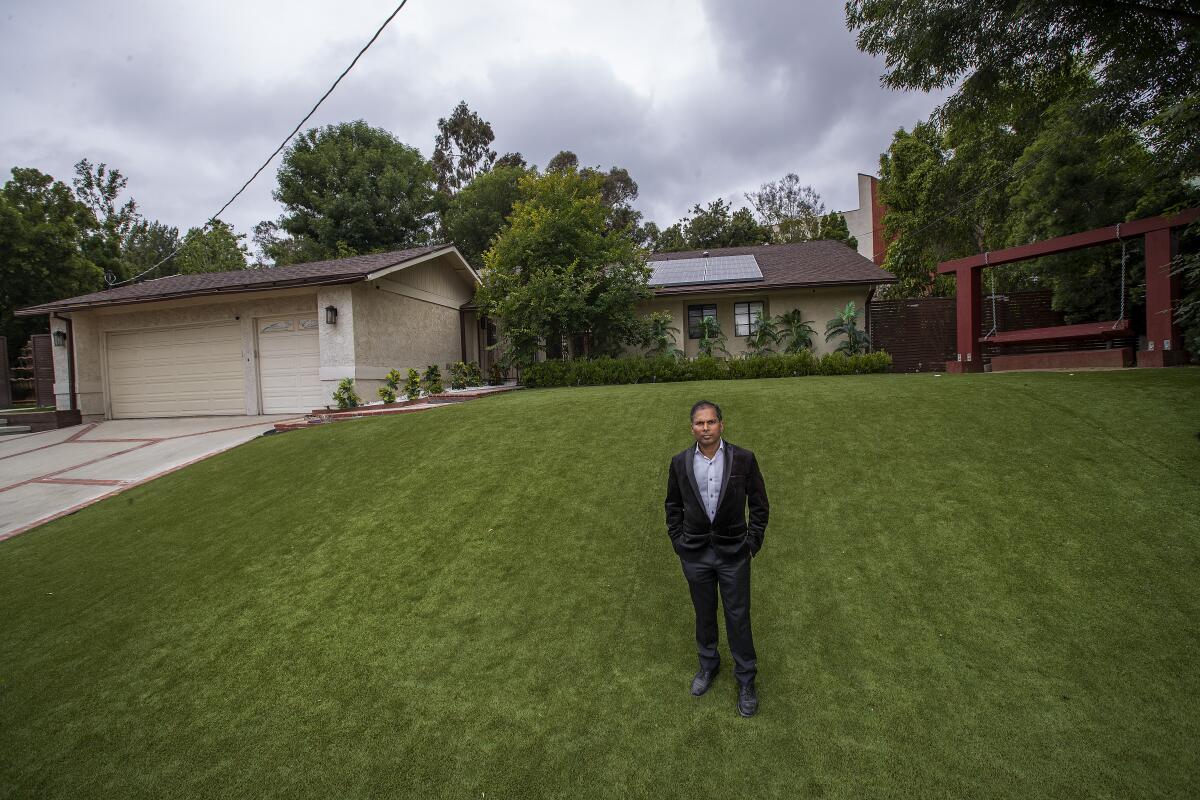 Akhilesh Jha on the lawn of a Woodland Hills home