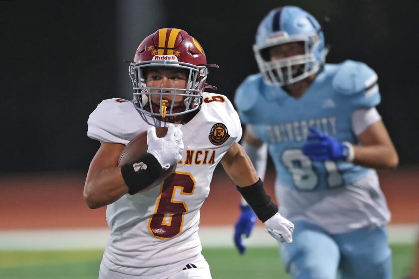 Estancia kick-off returner Brandon Bettinghausen runs around the defense for a touchdown.