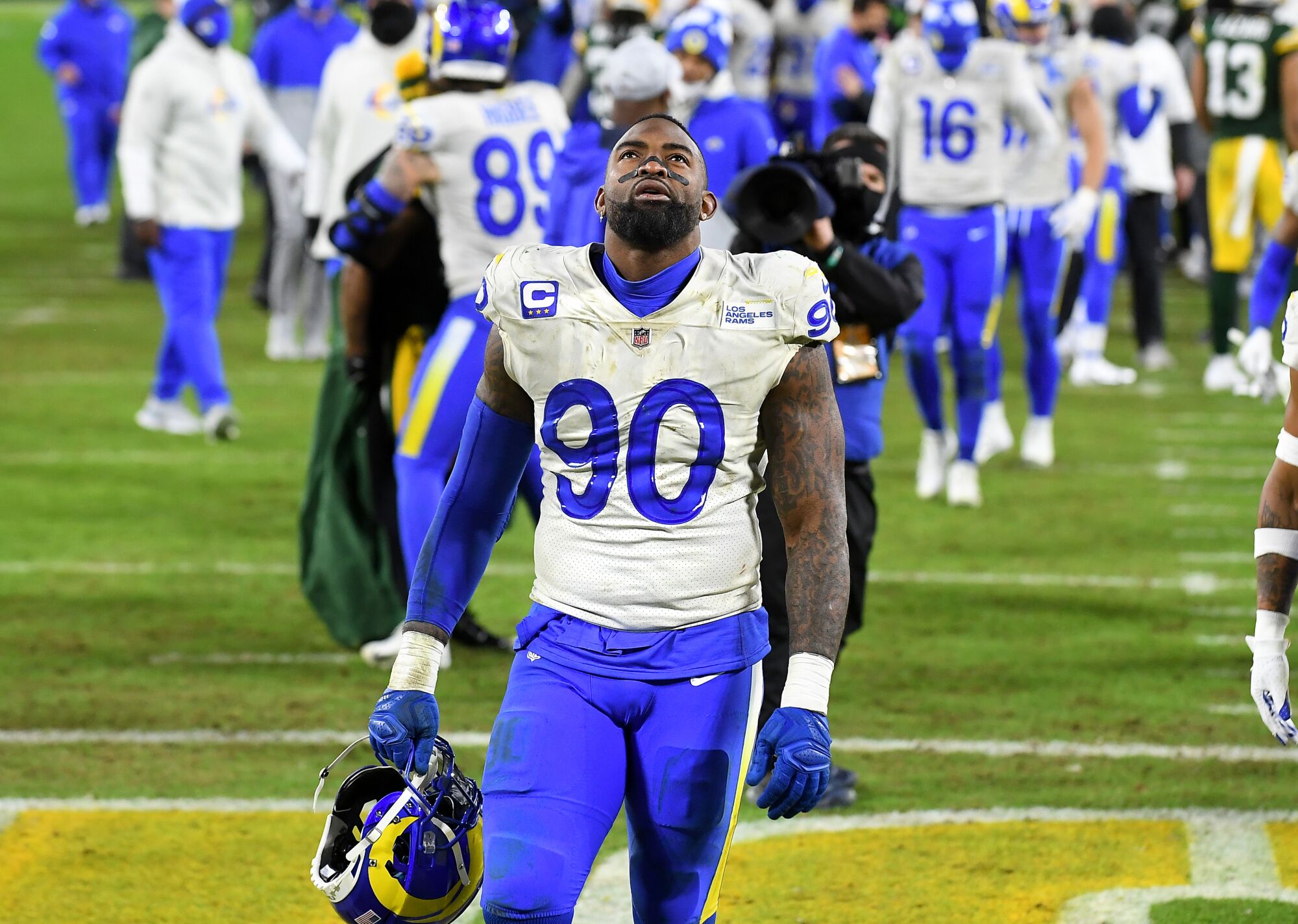 Rams defensive lineman Michael Brockers walks off the field after losing to the Green Bay Packers.