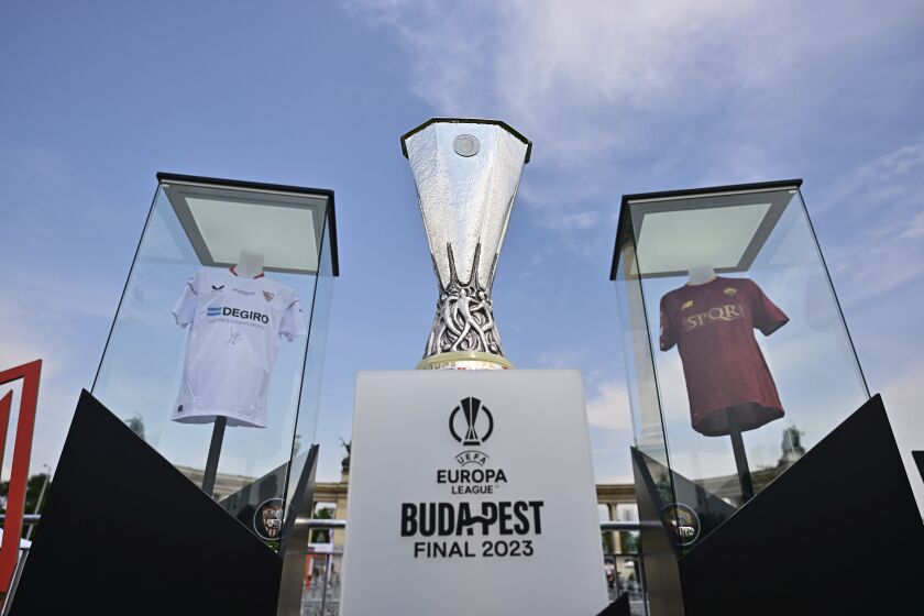 The UEFA Europa League Trophy is displayed in the Fan Zone at Heroes Square in Budapest, Hungary, Tuesday, May 30, 2023 one day before of UEFA Europa League final soccer match between Spanish club FC Sevilla and Italian club AS Roma in Budapest on Wednesday, May 31, 2023. (Marton Monus/MTI via AP)