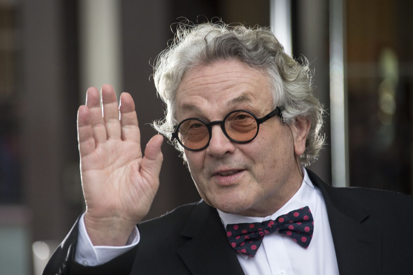 Jury Director George Miller poses for photographers upon arrival at Cannes for the 69th international film festival.