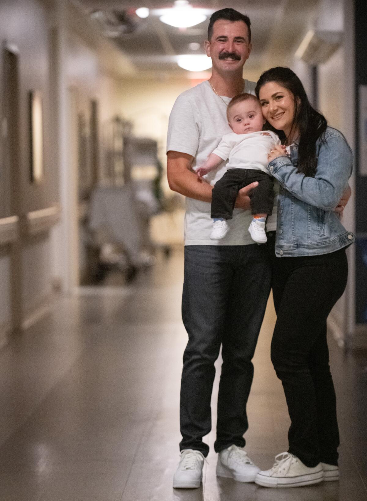 Mikey, Jay Nova and Megan Sanchez pose Wednesday in the Hoag NICU facility.