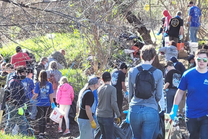 A large crowd of volunteers scoured Santa Maria Creek to remove 18,200 pounds of trash and debris in one day.