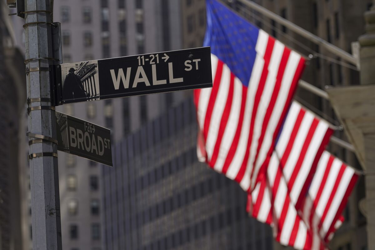 American flags fly outside the New York Stock Exchange, Friday, Sept. 23, 2022, in New York. 