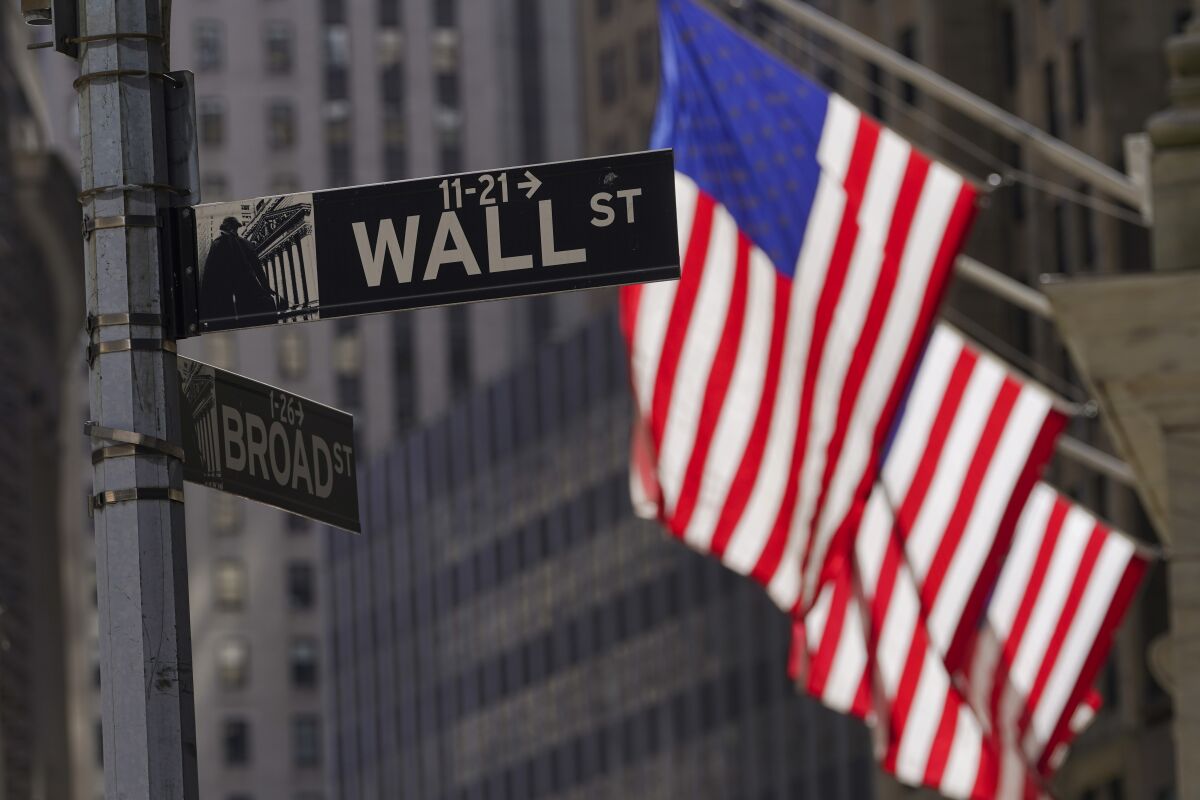 American flags fly outside the New York Stock Exchange, Friday, Sept. 23, 2022, in New York.