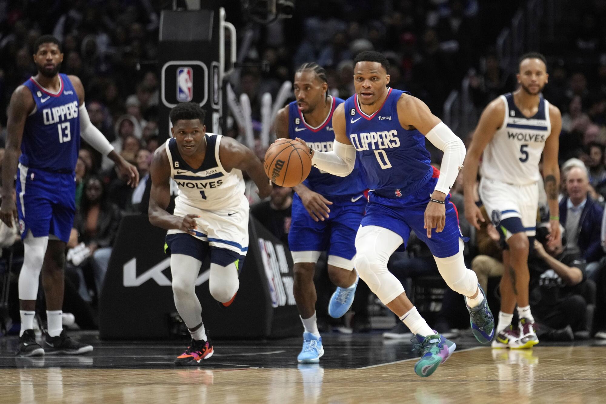 Clippers point guard Russell Westbrook brings the ball up during a fast break against the Minnesota Timberwolves.