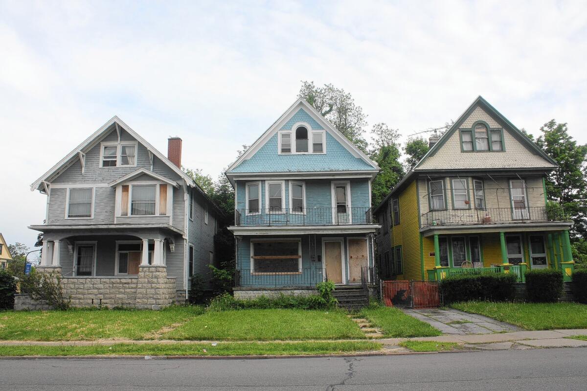 Many old homes in Buffalo, N.Y., are abandoned and targeted for demolition. Through the city's Urban Homestead program, preservation activists are getting residents to buy such homes for $1 each and promise to renovate and move into them.