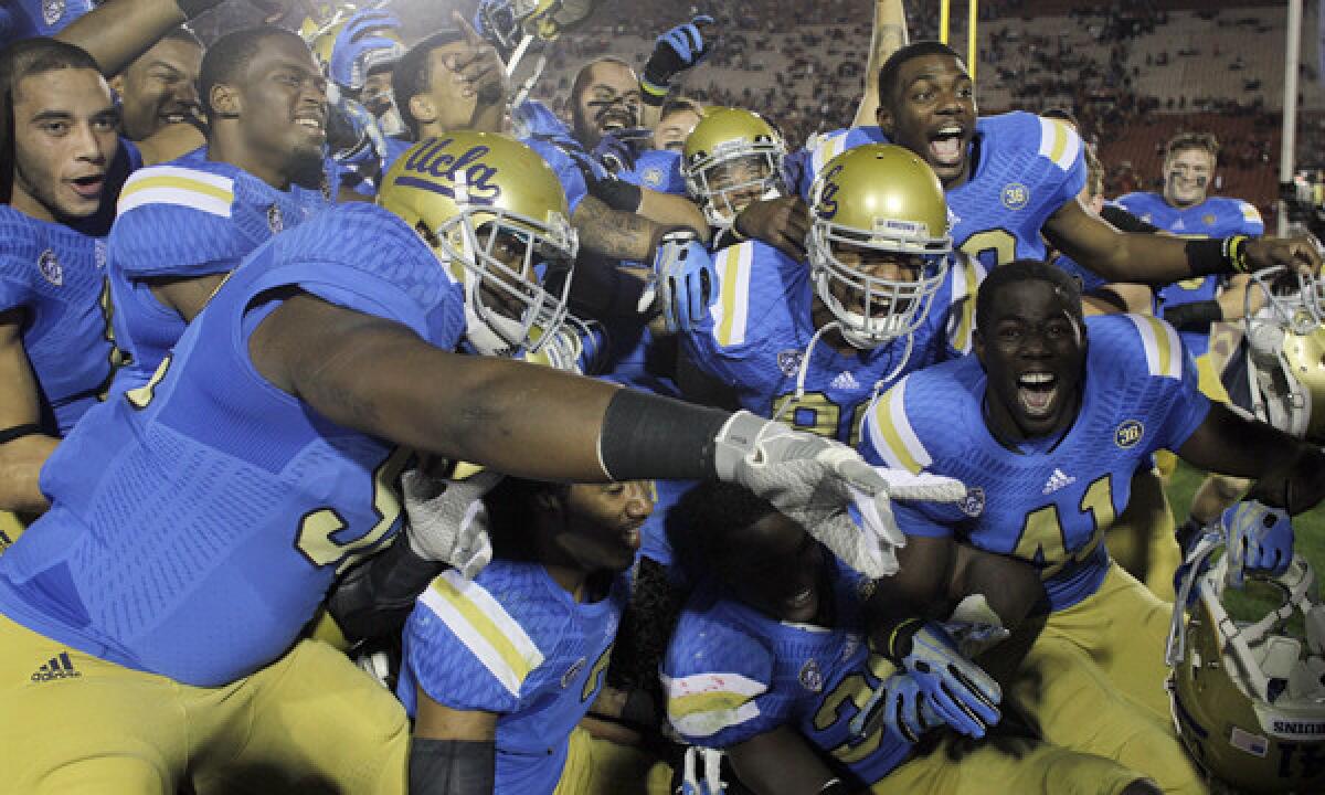 UCLA players celebrate their victory over crosstown rival USC last month. The Bruins hope to end the year -- and their season -- on a high note with a win over Virginia Tech in the Sun Bowl on Tuesday.