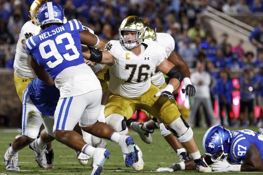 Notre Dame's Joe Alt (76) blocks during a game against Duke. He will switch to right tackle for the Chargers.