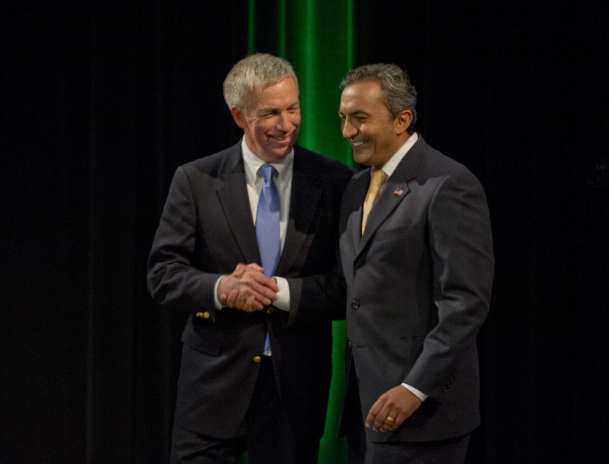 Incumbent, Democratic Rep. Ami Bera, right, and Republican Doug Ose, left, shake hands after debating for the 7th Congressional District in Sacramento last month.