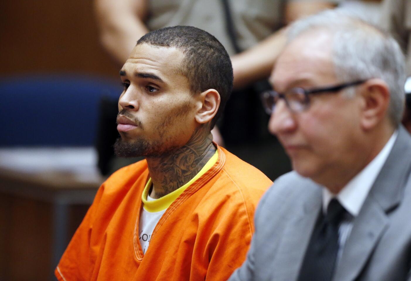 Singer Chris Brown appears in court with his attorney Mark Geragos on Monday for a probation violation hearing.