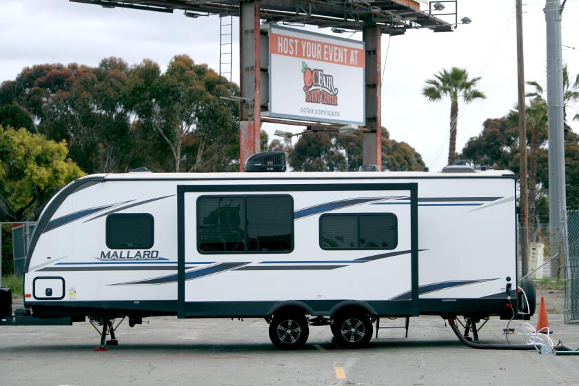A section of the Orange County Fairgrounds parking lot is being used by the city of Costa Mesa to park ten trailers to house members of its homeless population who may be vulnerable to coronavirus, on Friday, April 10, 2020. Those who will benefit from these mobile homes include homeless seniors or those having underlying health conditions.