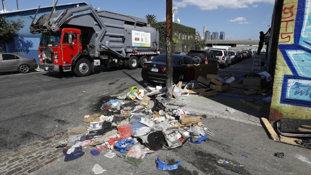 A pile of trash sits uncollected on Santee St. between 18th St. and Washington Blvd in the fashion district of Los Angeles on Oct. 11.