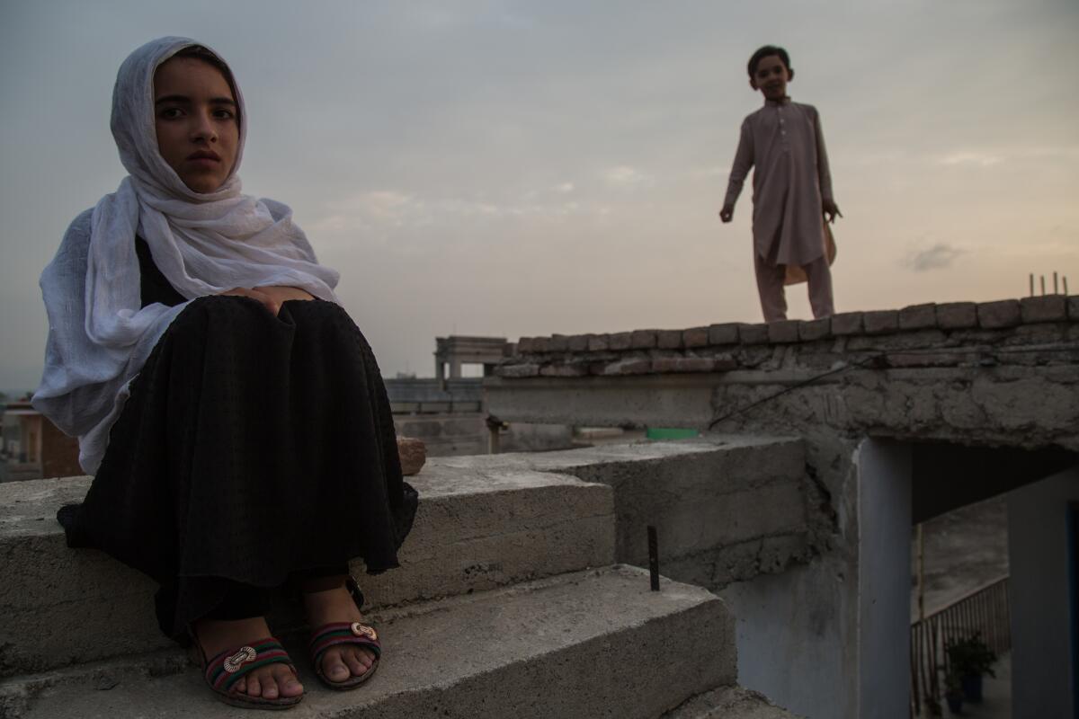 Hadia Mustaghn, 8, witnessed a house raid that left three of her uncles dead. The family has since moved to Khost city, the provincial capital, but Hadia says she's constantly afraid. 