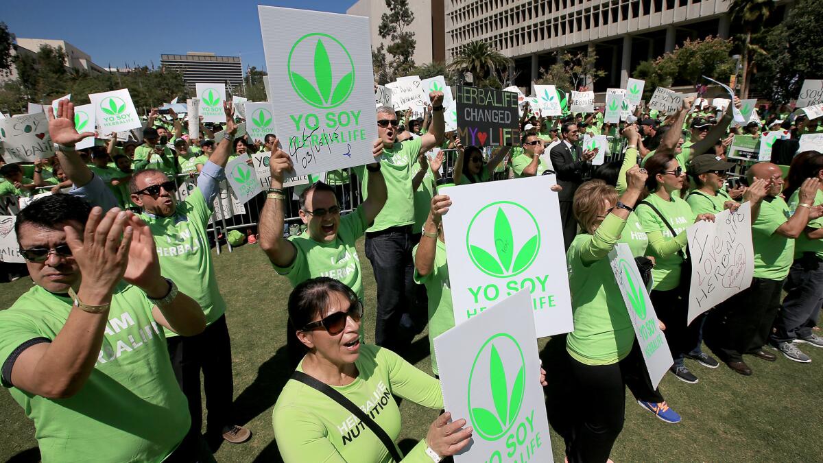 But where are the distributors' mansions? Herbalife got some of the faithful to turn out for a pro-company demonstration in downtown Los Angeles last year.