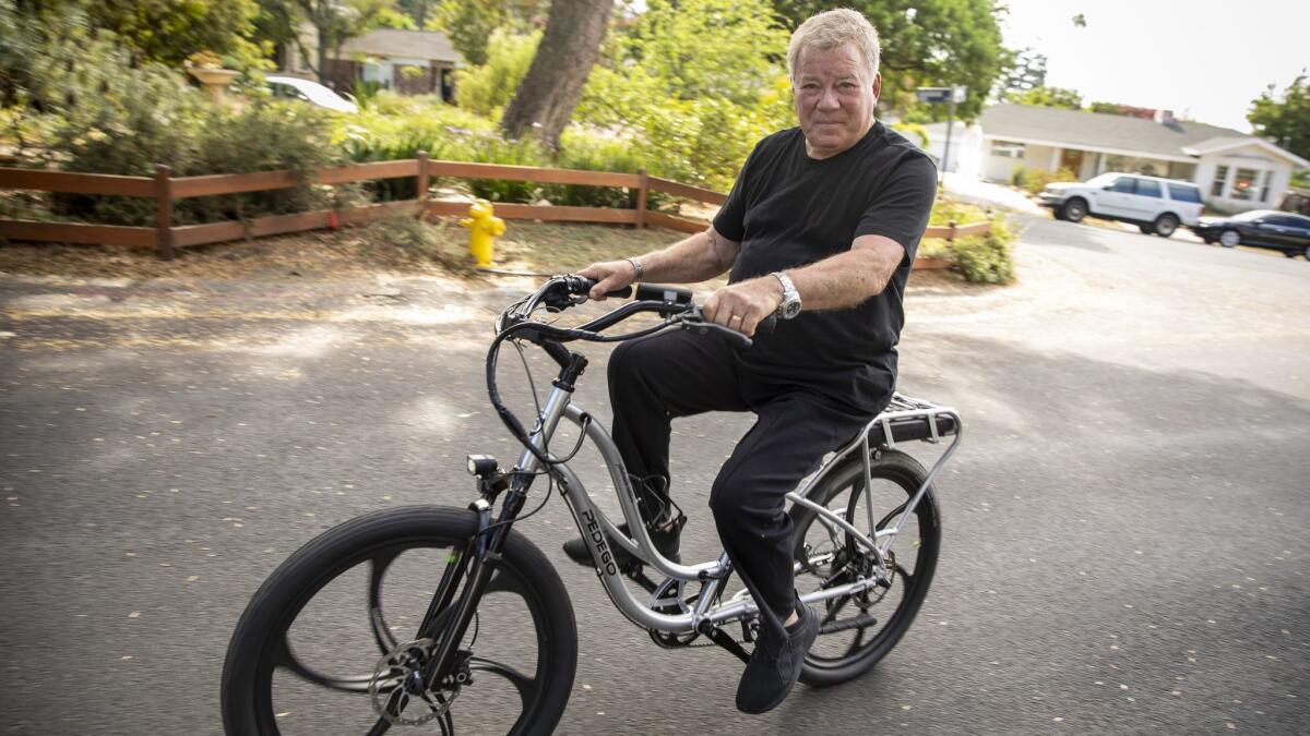 Shatner says he relies on horseback riding and cycling, including this e-bike, to maintain balance and stay fit.