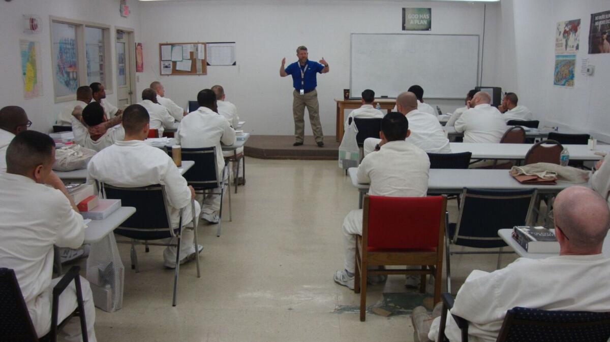Benjamin Phillips of the Southwestern Baptist Theological Seminary leads a class in a seminary program at a Texas state prison.