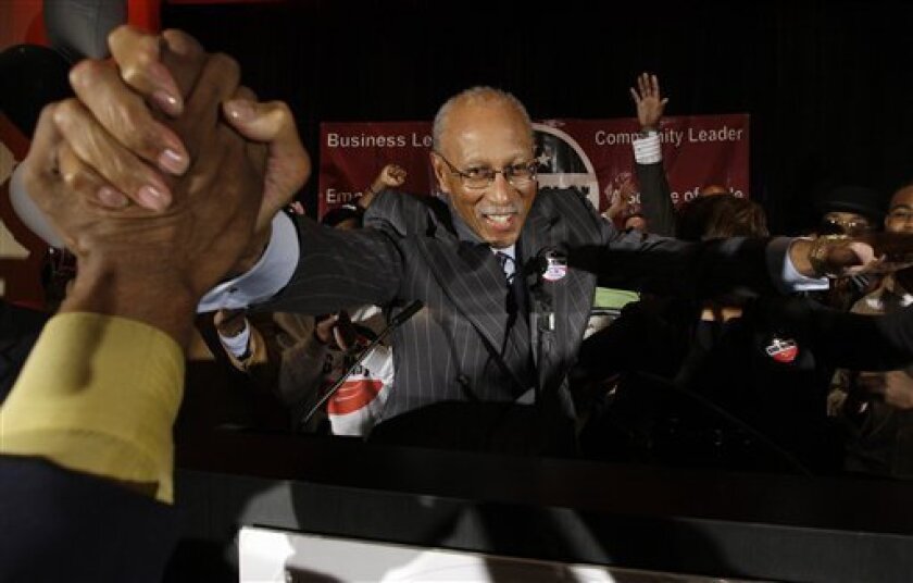 Former NBA basketball star Dave Bing celebrates his mayoral victory in Detroit, Tuesday, May 5, 2009. Detroit voters elected Bing as their mayor, sweeping incumbent Ken Cockrel Jr. from office and giving the ex-Pistons great at least through the end of the year to make a dent in the city's myriad problems. (AP Photo/Paul Sancya)