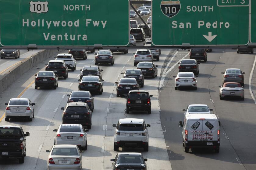 LOS ANGELES, CA - JUNE 16: Afternoon traffic crawls along the 101 freeway through downtown Los Angeles on Wednesday, June 16, 2021. Few changes are a greater indicator of the city's return to the "before" times than the resurgence of traffic. (Myung J. Chun / Los Angeles Times)