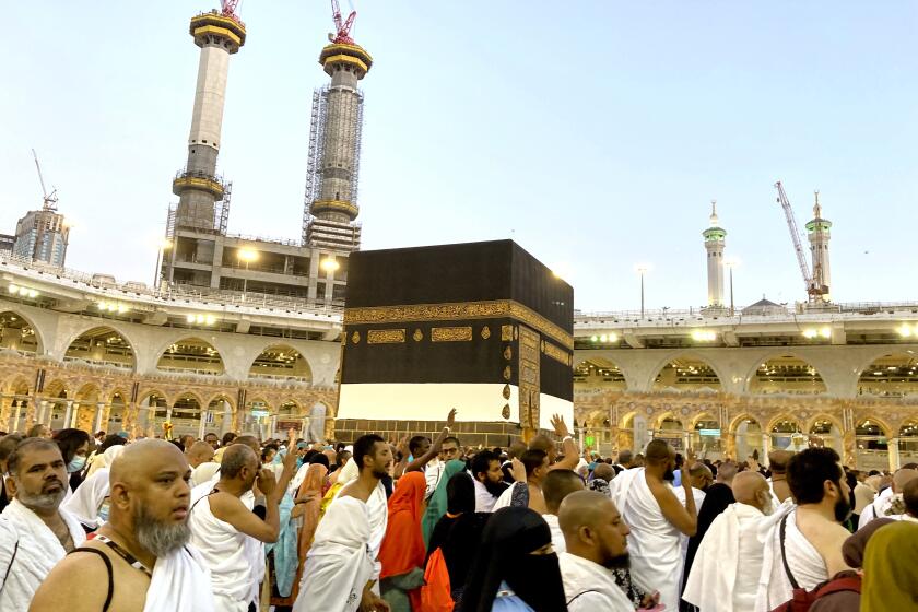 Thousands of Muslim pilgrims circumambulate around the Kaaba, the cubic building at the Grand Mosque, in the Saudi Arabia's holy city of Mecca, Tuesday, July 5, 2022. Saudi Arabia is expected to receive one million Muslims to attend Hajj pilgrimage, which will begin on July 7, after two years of limiting the numbers because coronavirus pandemic. (AP Photo/Amr Nabil)