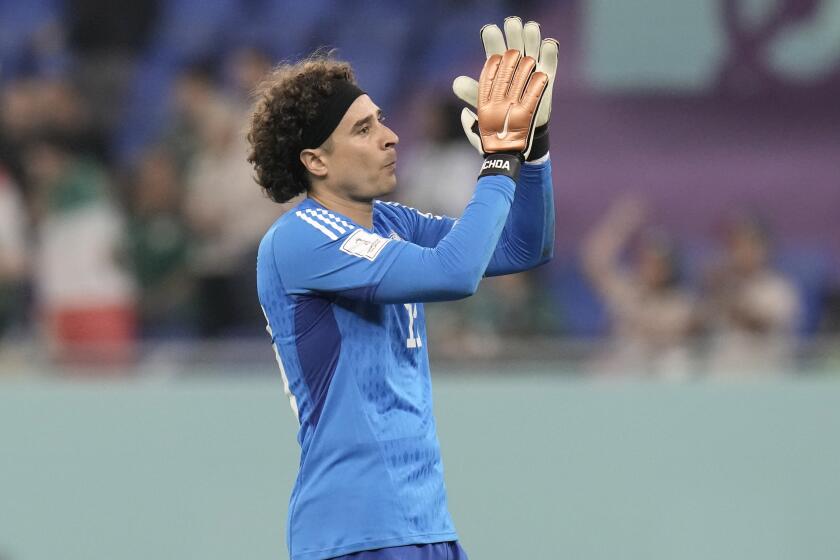 Mexico's goalkeeper Guillermo Ochoa acknowledges the supporters after the World Cup group C soccer match between Mexico and Poland, at the Stadium 974 in Doha, Qatar, Tuesday, Nov. 22, 2022. (AP Photo/Moises Castillo)
