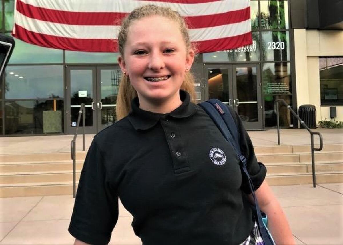 Rock Academy eighth grader Taylor Harris raised $5,000 to erect a flag pole in front of her school. 