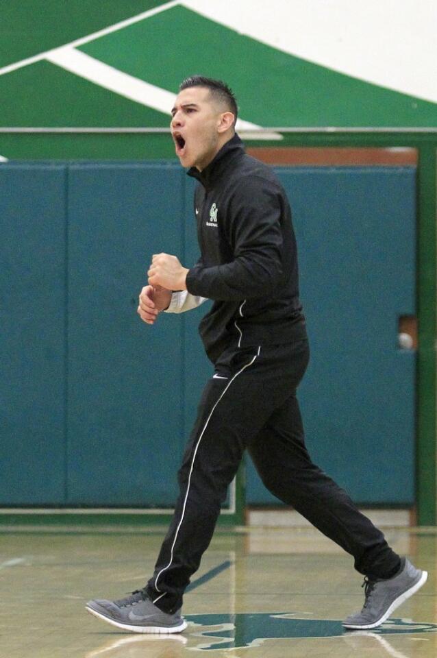 Costa Mesa High head coach Mike Molina is fired up after the Mustangs go on a run during the second quarter against Harvard-Westlake in a CIF-Southern Section Division 4AA first-round game on Wednesday.