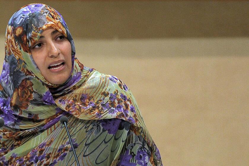 In this file photo from last October, Nobel Peace Prize winner and Yemeni journalist and activist Tawakul Karman delivers a speech during the opening of the World Forum for Democracy in the Council of Europe in Strasbourg, France.
