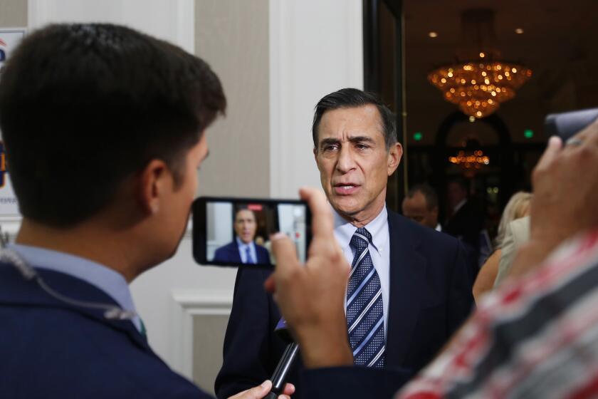 Darrell Issa, who is running for the 50th Congressional District speaks with reporters at the U.S. Grant Hotel on March 3, 2020.