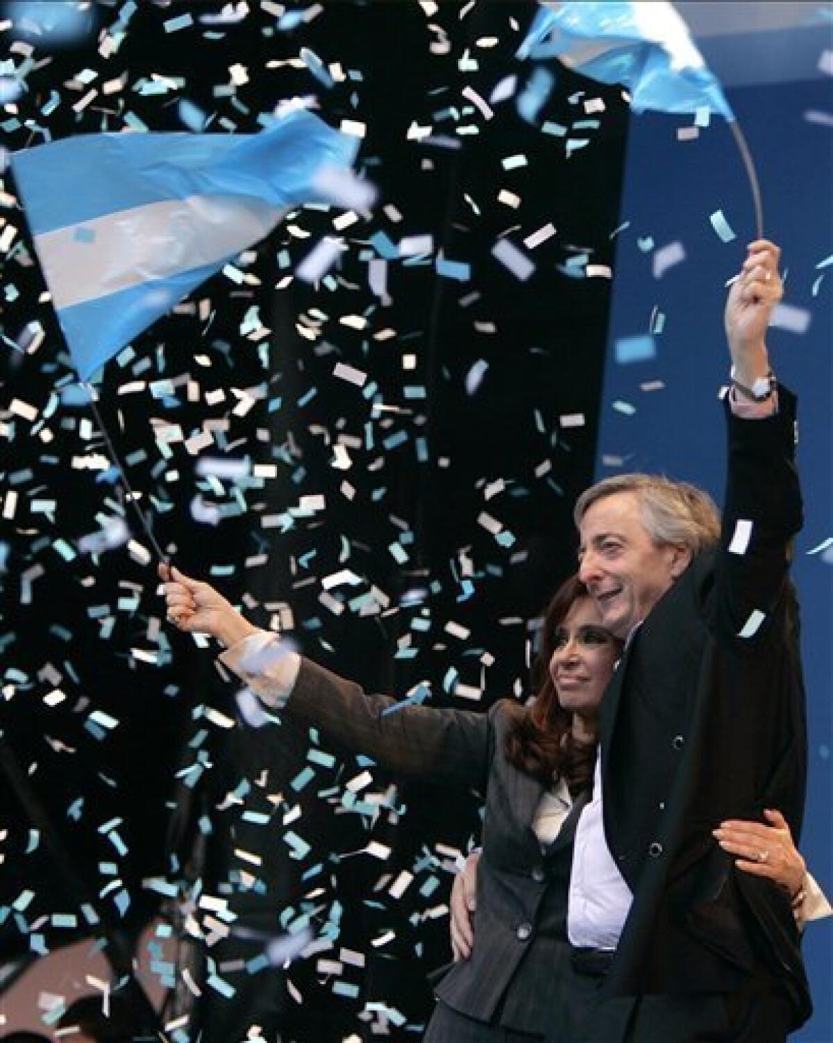 FILE - In this June 18, 2008 file photo, Argentina's President Cristina Fernandez de Kirchner, left, and her husband former president Nestor Kirchner wave to supporters at a pro-government rally in Buenos Aires, Argentina. According to state television in Argentina, Nestor Kirchner died on Wednesday Oct. 27, 2010 of a heart attack at age 60. (AP Photo/Eduardo Di Baia, File)