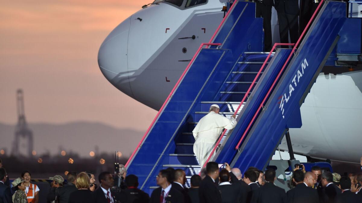Pope Francis boards his plane back to Rome, at the airport in Lima, Peru, on Jan. 21, 2018.