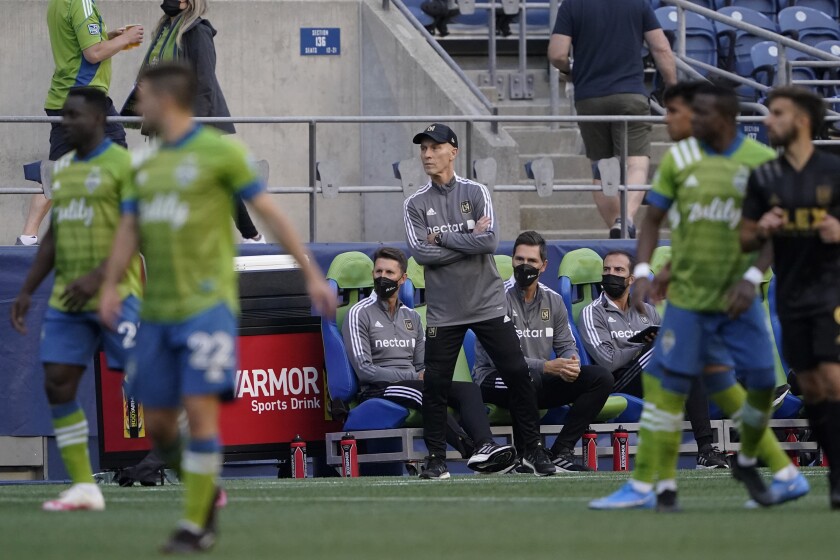 LAFC coach Bob Bradley watches from the sideline during a match against the Seattle Sounders