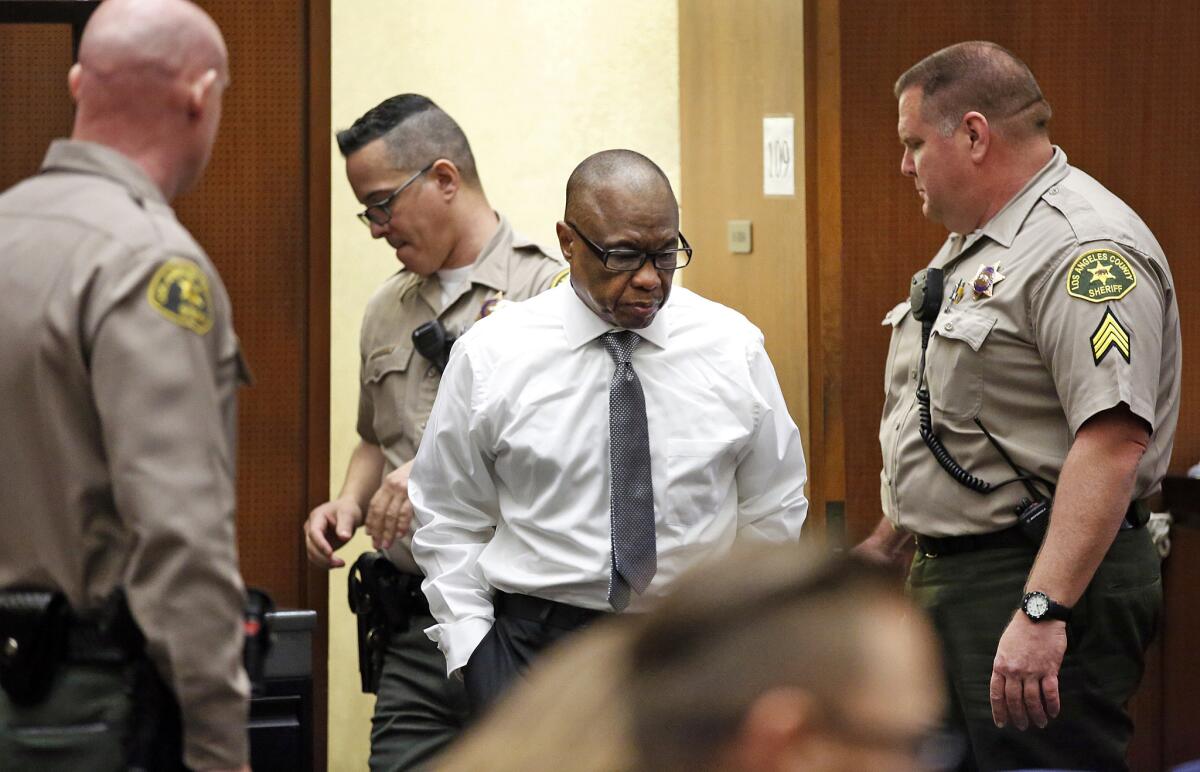Lonnie Franklin Jr. enters the courtroom early in his murder trial. Franklin is charged with the so-called Grim Sleeper killings that terrorized South L.A. over more than two decades.
