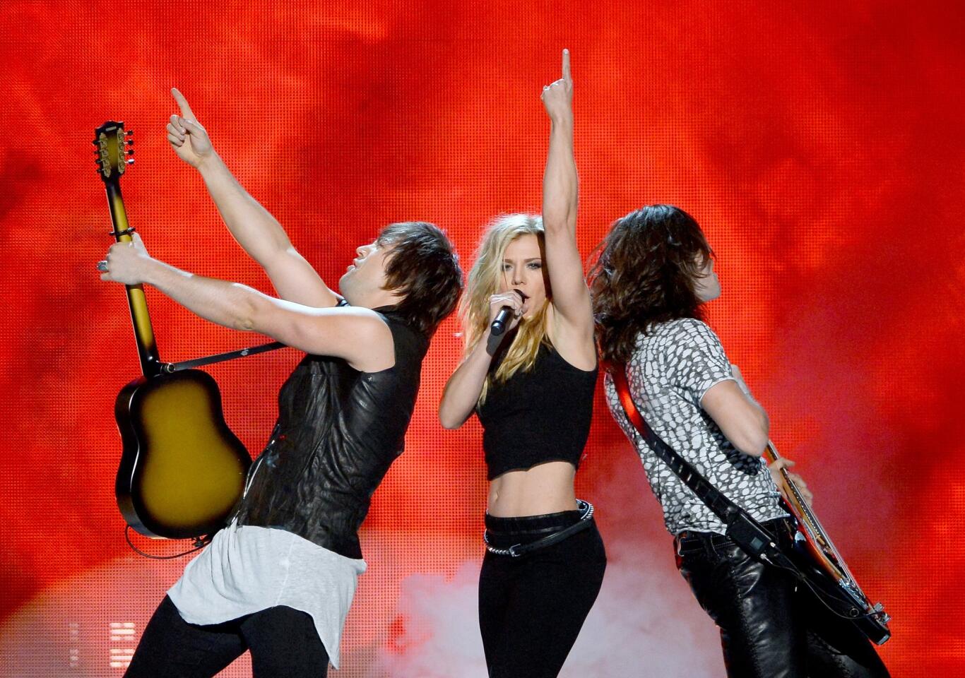Musicians Neil Perry, left, Kimberly Perry and Reid Perry of the Band Perry perform during the 49th Academy of Country Music Awards at the MGM Grand Garden Arena in Las Vegas on Sunday night.