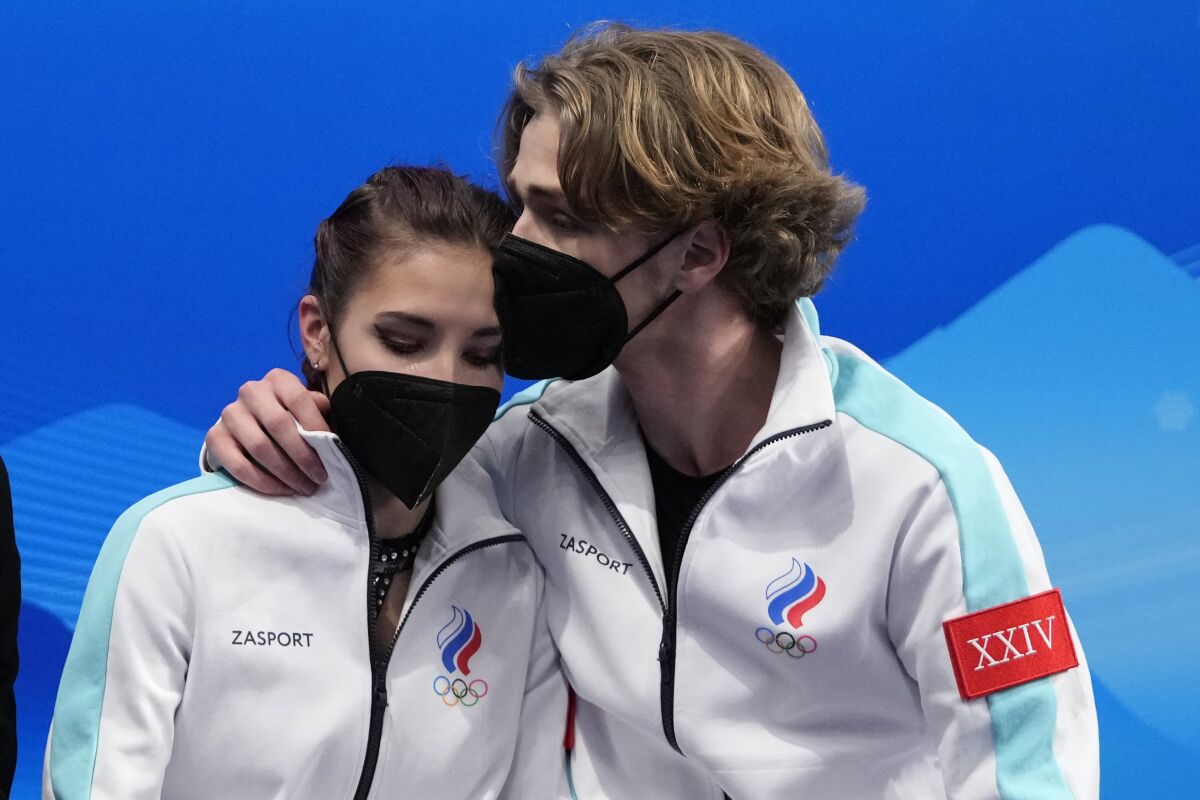 Diana Davis and Gleb Smolkin, of the Russian Olympic Committee, react after their routine in the ice dance competition during figure skating at the 2022 Winter Olympics, Saturday, Feb. 12, 2022, in Beijing. (AP Photo/Natacha Pisarenko)
