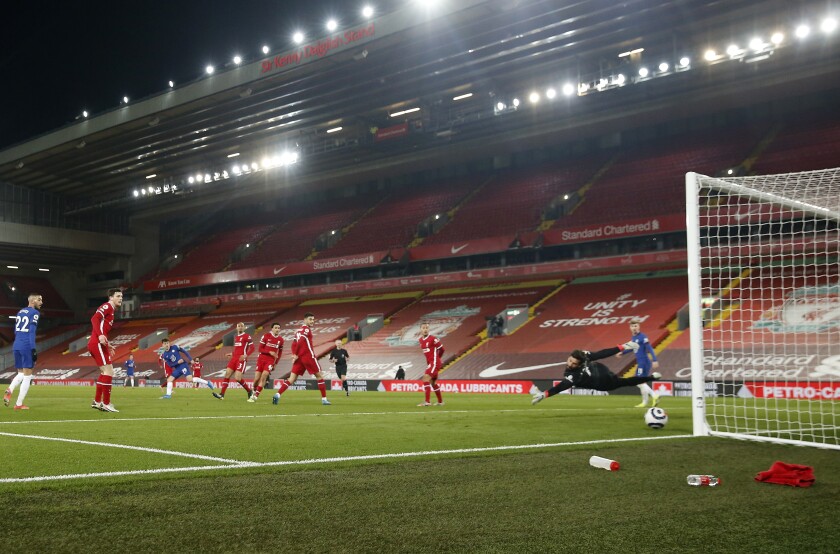 Chelsea's Mason Mount, third from left, scores his side's opening goal during the English Premier League soccer match between Liverpool and Chelsea at Anfield stadium in Liverpool, England, Thursday, March 4, 2021. (Phil Noble, Pool via AP)