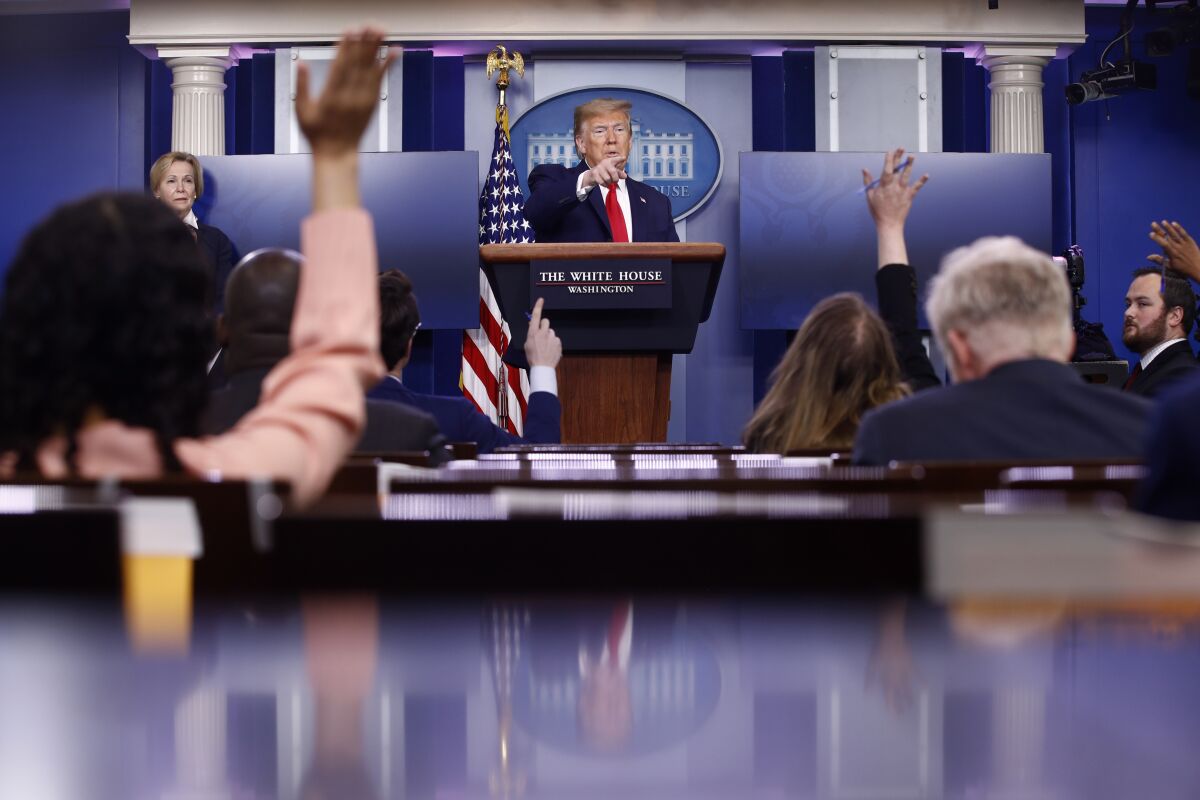 President Trump calls on reporters during a news conference on Saturday at the White House.