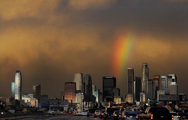 A rainbow brightens an otherwise gloomy scene in downtown Los Angeles.