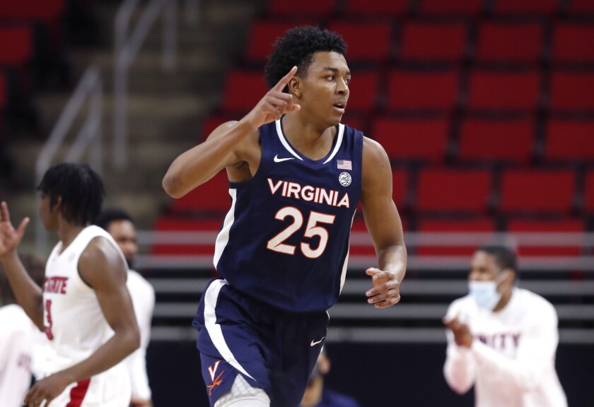 Trey Murphy III heads back on defense after scoring for Virginia.